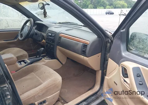 1999 Jeep Grand Cherokee Laredo from USA, damaged, VIN 1J4GW58S1XC525412